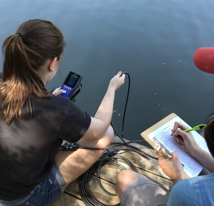 Two students testing water