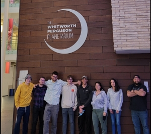 Students stand outside of the Whitworth Ferguson Planetarium